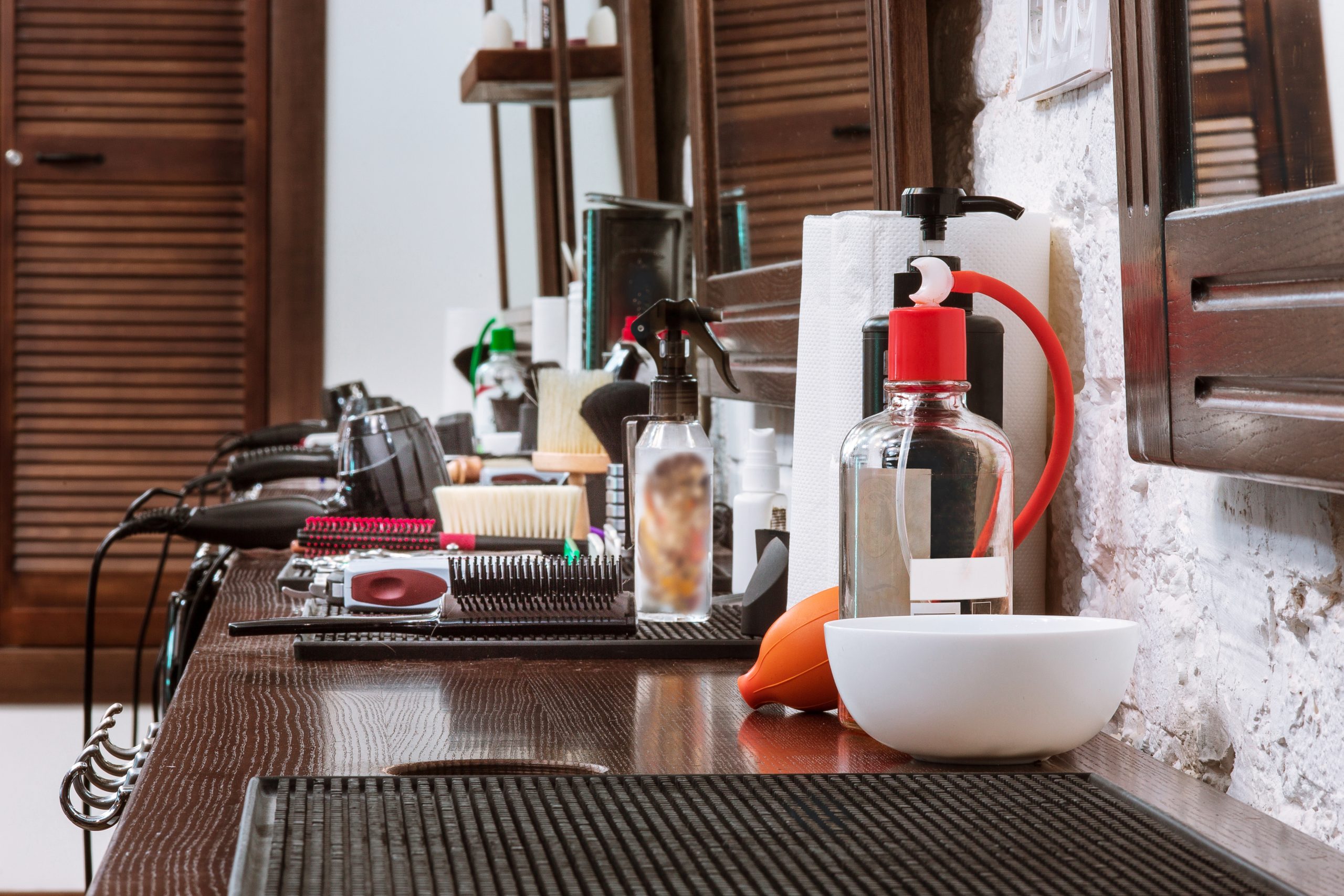 Barber shop equipment on wooden background.